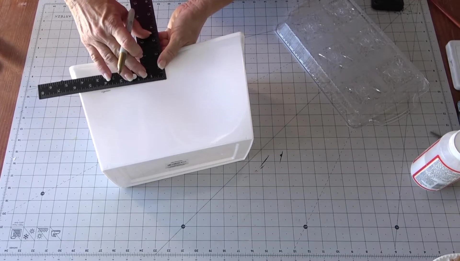 Measuring and marking the locker box for cutting.