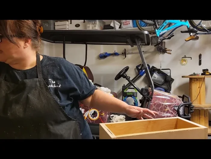 Sand the box to smooth the surfaces.