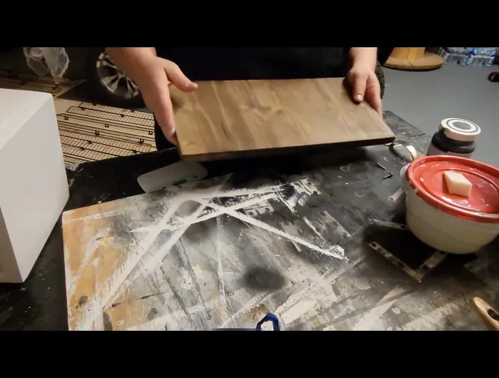 Drill holes for handles and attach the handles to the lid.