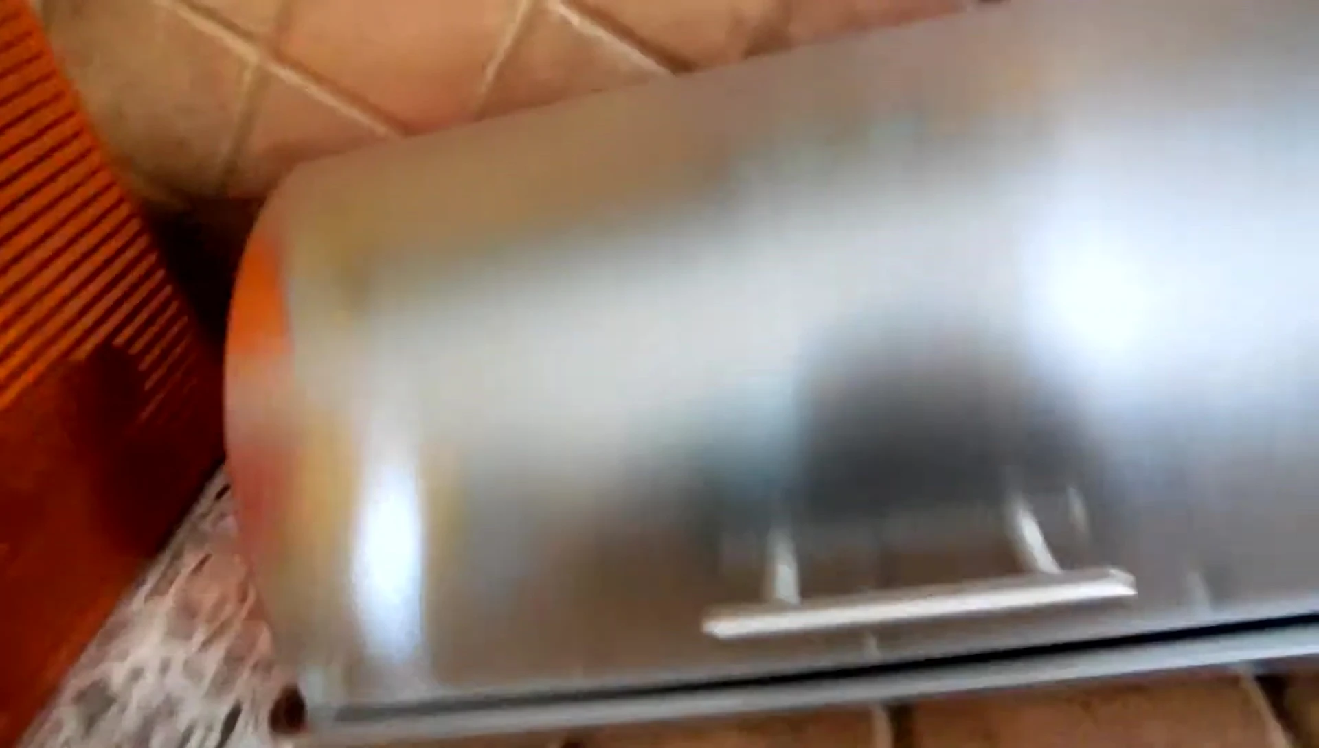 Showcase of the roll-top lid and stainless steel finish.