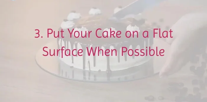 Place the cake on a flat, stable surface during transport.