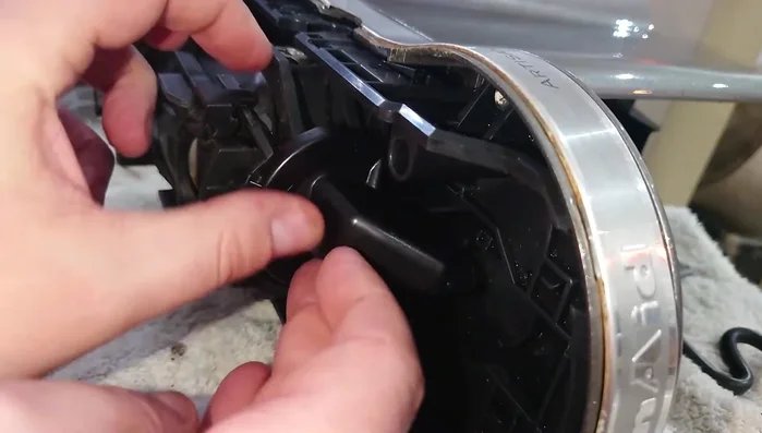 Install the new Nespresso compatible steam cap. Attach the bottom clip first, then snap the top clip into place.