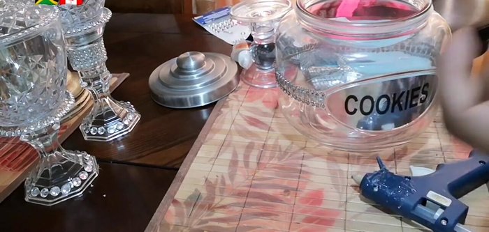 Add individual rhinestones around the top rim of the jar.