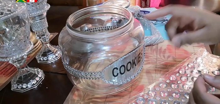 Add individual rhinestones around the top rim of the jar.
