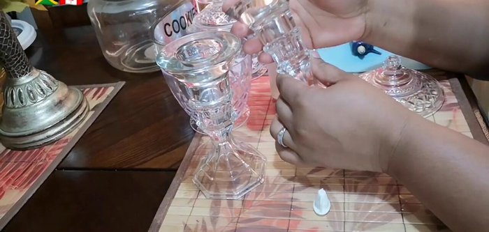 Glue a smaller container upside down onto the base of the larger jar.