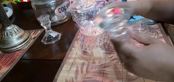 Glue a smaller container upside down onto the base of the larger jar.