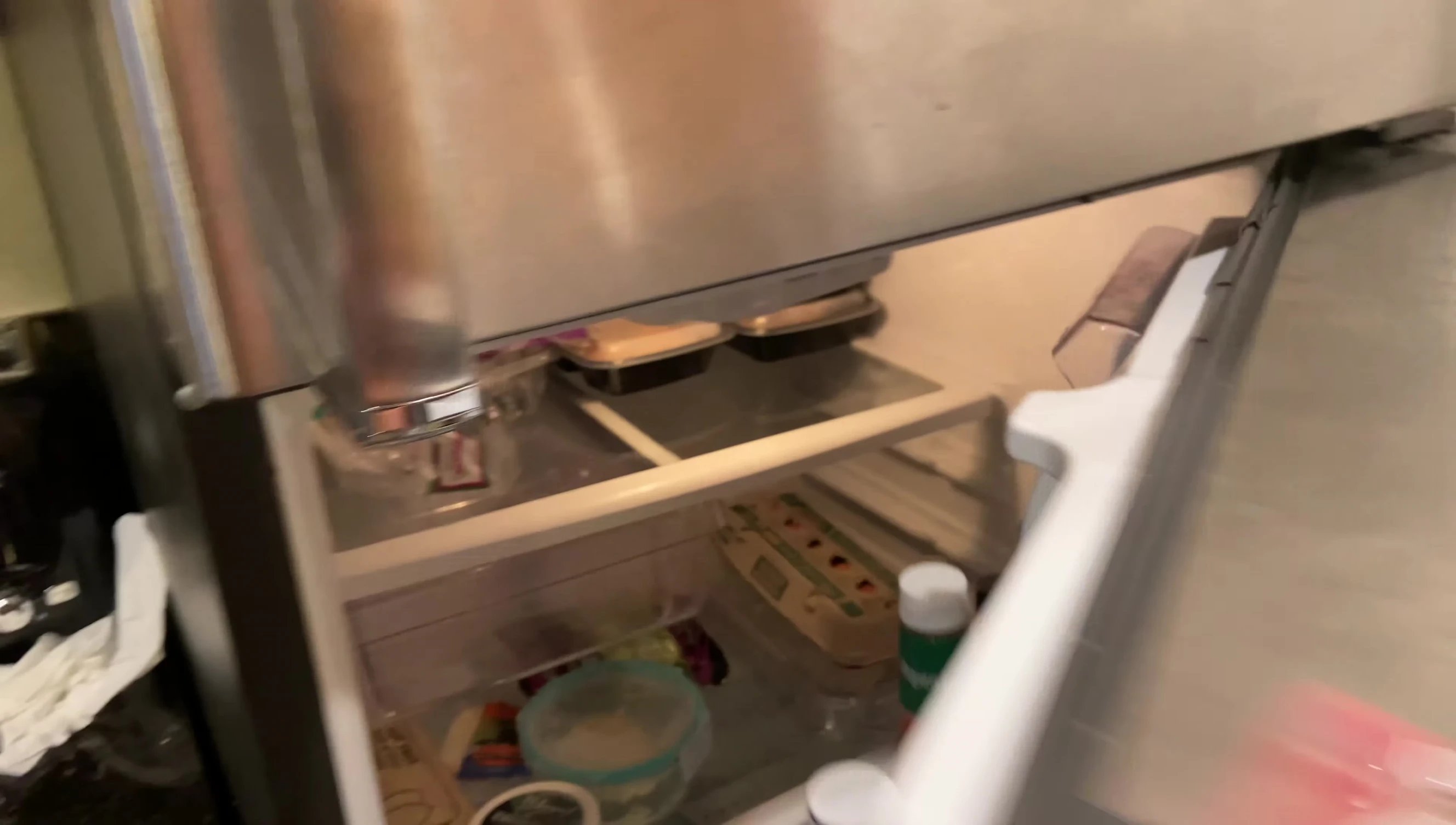 Containers neatly stacked in a refrigerator