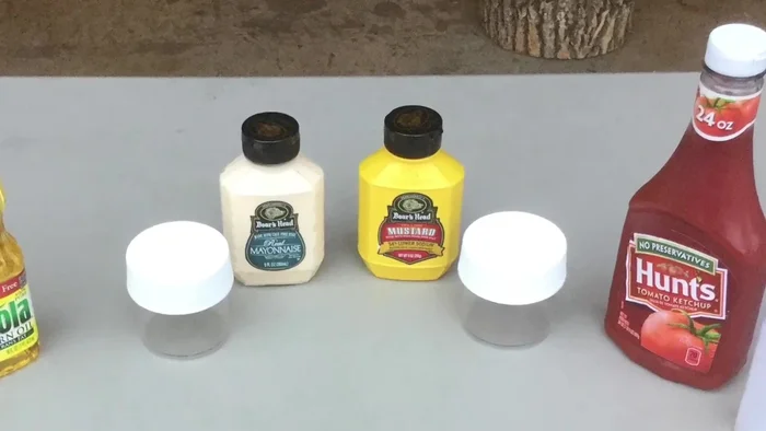 Use larger plastic jars (originally peanut butter jars) to store various dry goods like peanuts, crackers, cookies, hot chocolate, tea, and oatmeal.