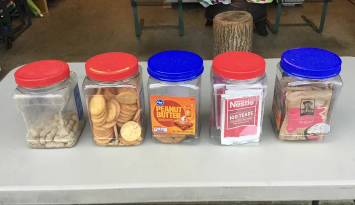Use larger plastic jars (originally peanut butter jars) to store various dry goods like peanuts, crackers, cookies, hot chocolate, tea, and oatmeal.