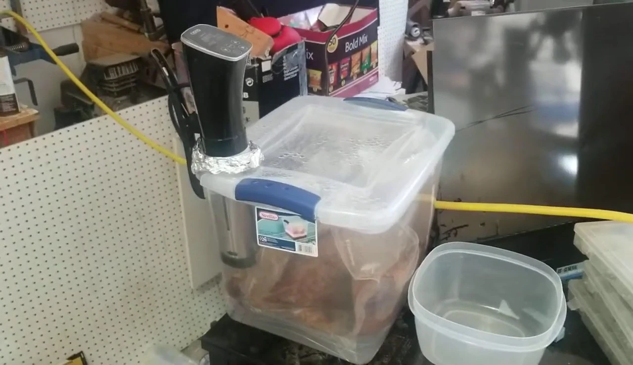 The Sterilite container filled with tri-tips during the sous vide process.