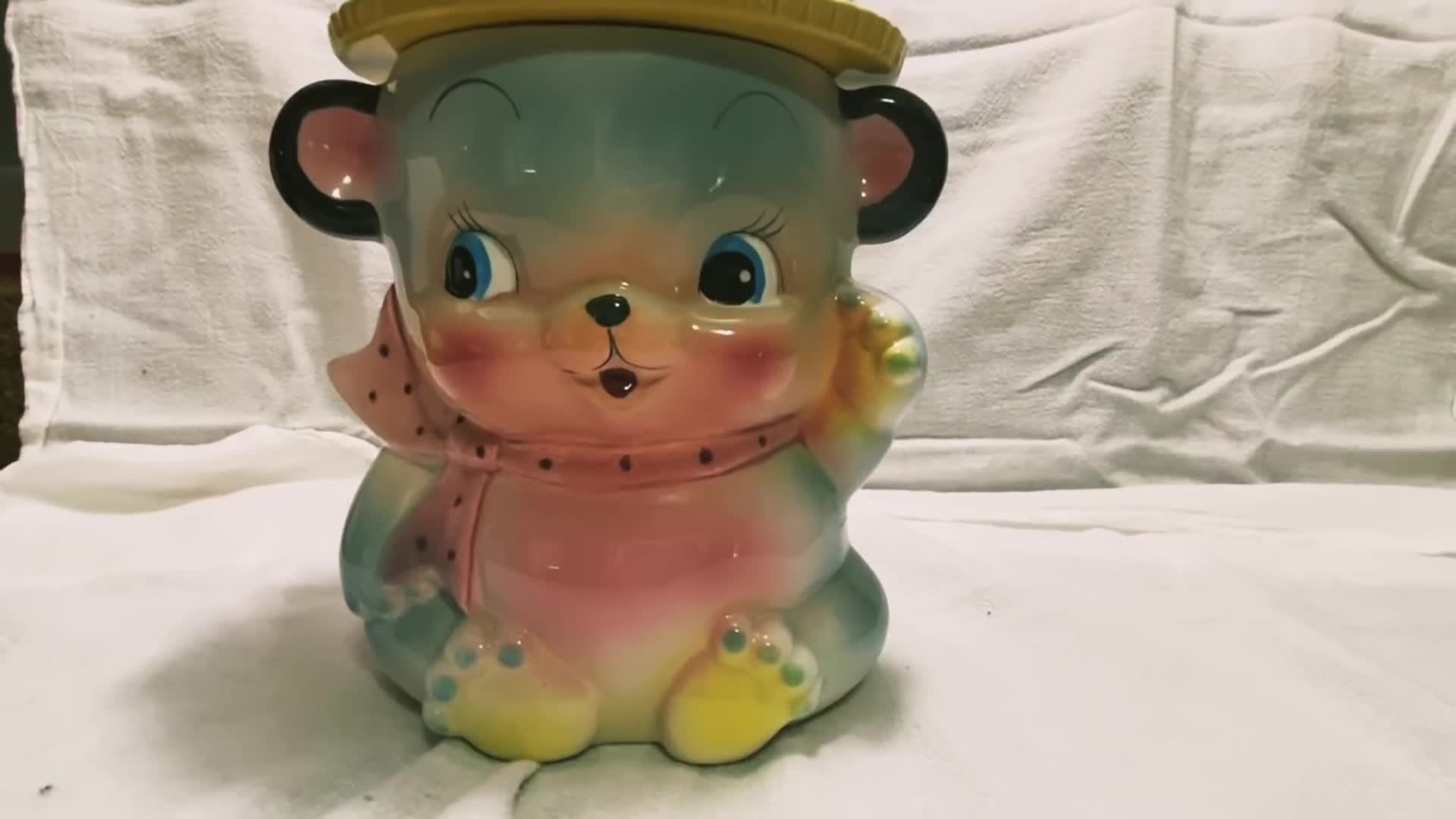 Close-up of the waving kitten cookie jar
