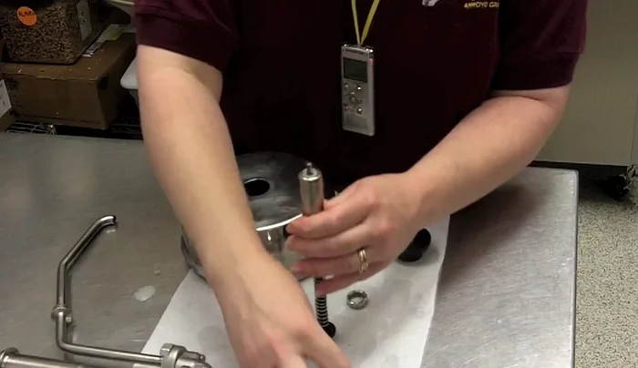 Place the stick inside, followed by the knob. Fold the bottom of the knob to allow screwing on the top.