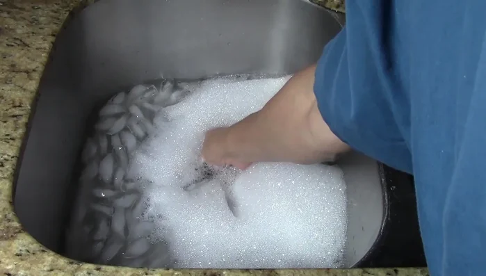 Remove the sink stopper and let the ice and water flush through the disposal.