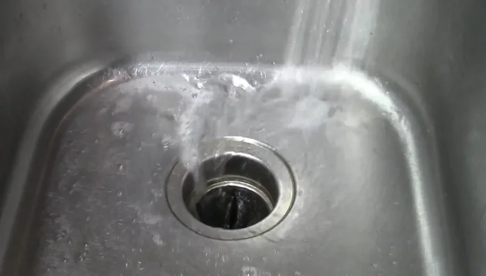 Run the disposal with water to rinse away the bleach.