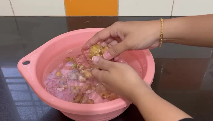 For ginger: Partially wash to loosen dirt, break into smaller pieces, and clean with a brush or knife.