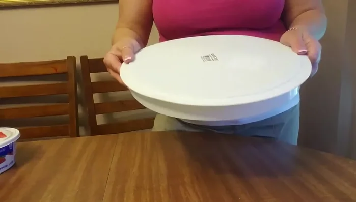 Place the cake on the carrier's base, ensuring it doesn't extend beyond the ridge.