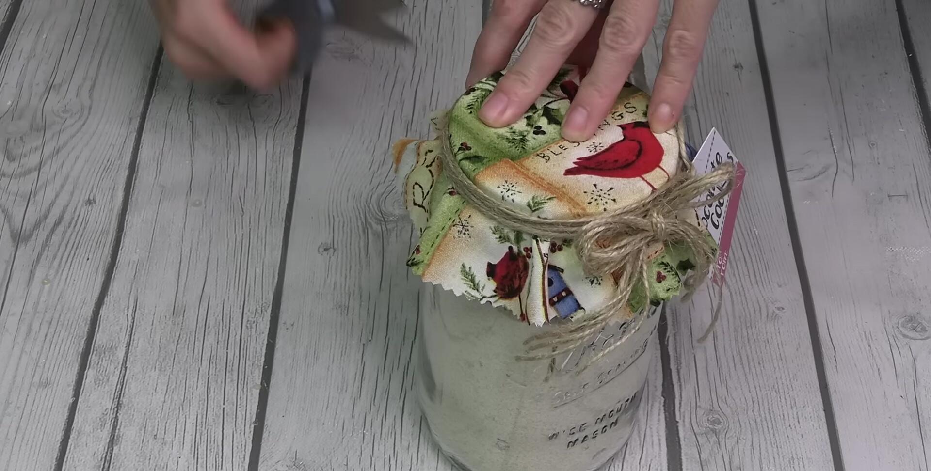 Mason jar with cookie mix, decorated with tag and twine