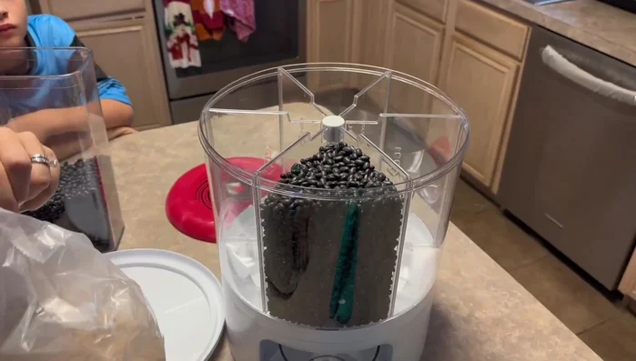 If using different grains, utilize the removable divider to separate them into different sections.