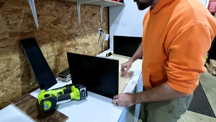 Assemble the side pieces to the base. Use nails to secure the side pieces to the base, ensuring the back of the dispenser is elevated for the desired slope.