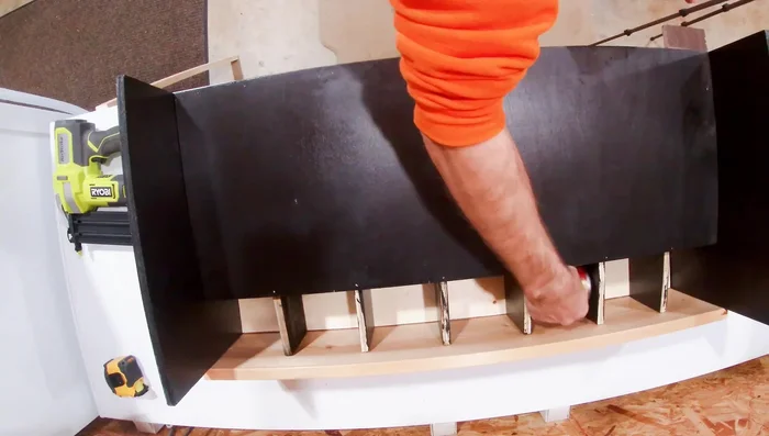 Add a back piece to prevent cans from getting stuck in the back. This piece should be slightly wider than the can to ensure smooth rolling.