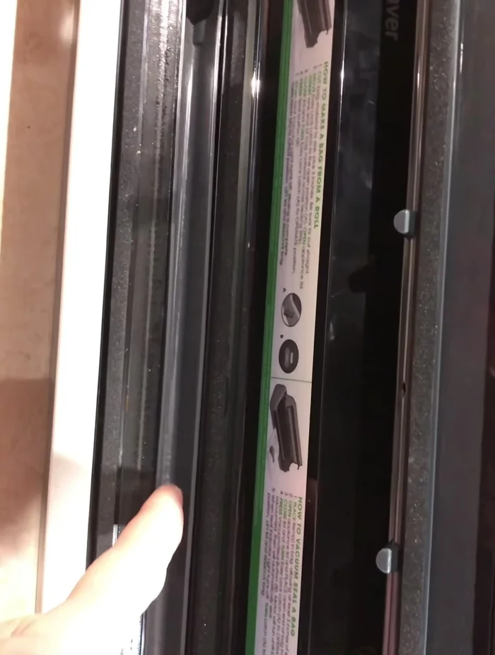 Place the bag with liquid on the edge of the tray, ensuring it's aligned with the drip channel.