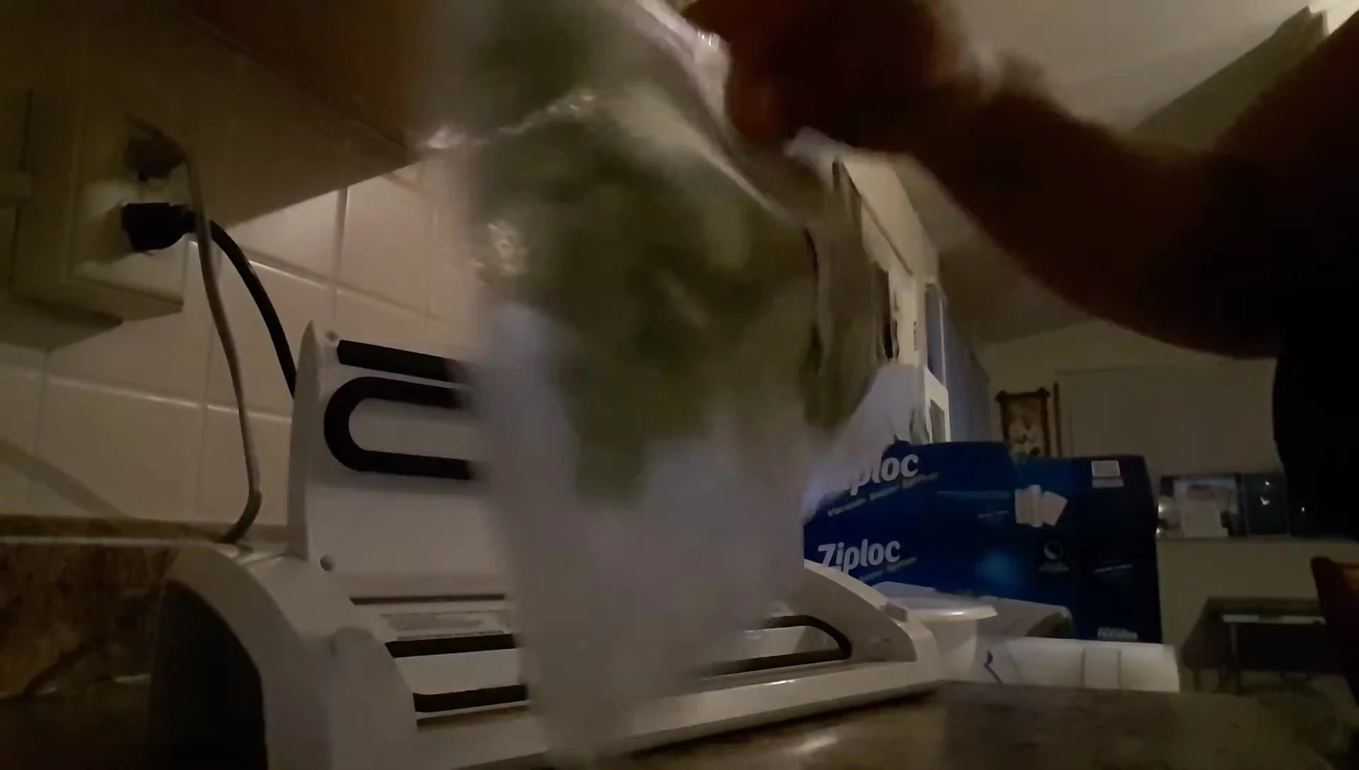 The sealed bag of okra, showing insufficient vacuuming