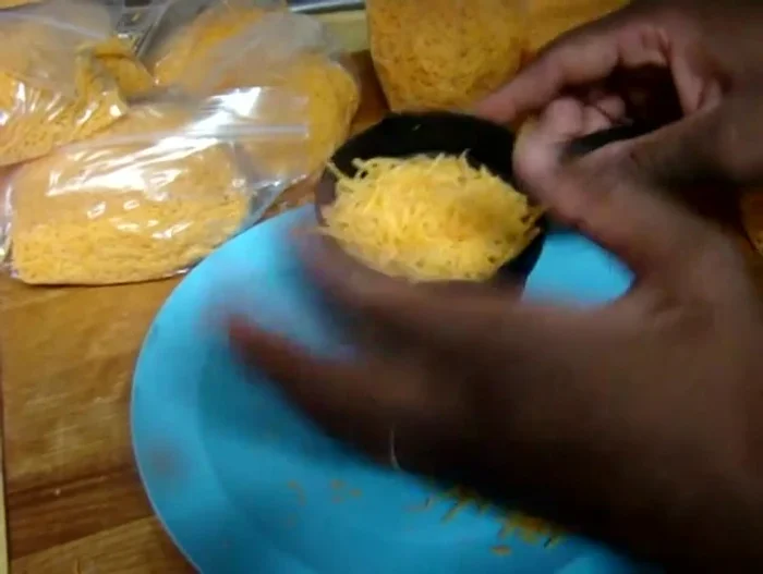 Optional: Stack the filled bags on a plate to catch any cheese that spills while removing them from the larger bag.