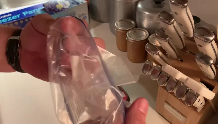 Wrap the sealed bag with freezer paper, waxy side up, like a gift. Prepare multiple pieces of freezer paper in advance if freezing a large amount of meat.