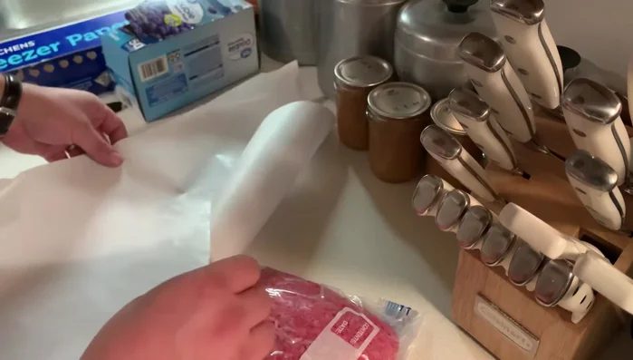 Wrap the sealed bag with freezer paper, waxy side up, like a gift. Prepare multiple pieces of freezer paper in advance if freezing a large amount of meat.