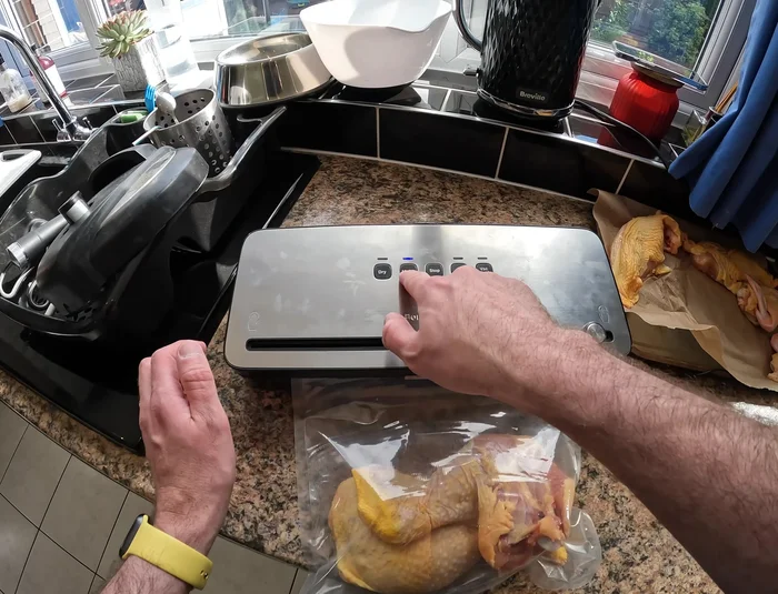 Wait for the sealing process to complete. The red light on the machine will indicate completion.