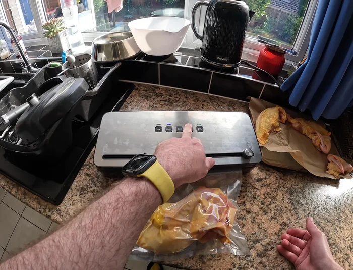 Wait for the sealing process to complete. The red light on the machine will indicate completion.