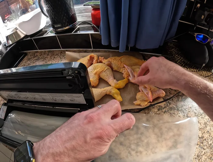 Place chicken portions into the bag, leaving adequate space between the food and the edges of the bag.