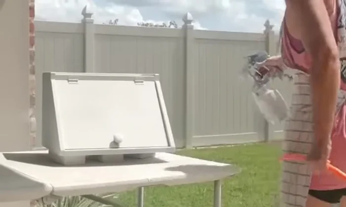 Distress the breadbox: Using an orbital sander to stress the edges and create a vintage look.