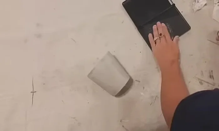 Seal the cups: Applying Rustoleum clear coat to seal the stamped design.