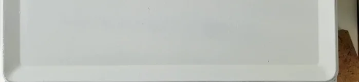 Carefully center and adhere the vinyl design to the front of the bread box using transfer paper.