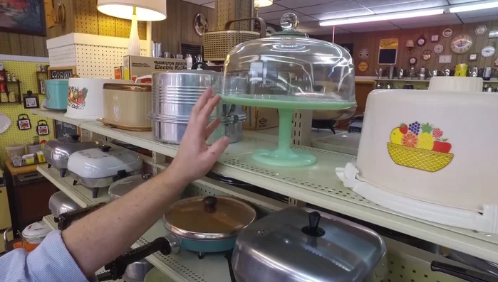 Display more aluminum cake carriers by Regal and West Bend, highlighting their variations in design and sturdiness.