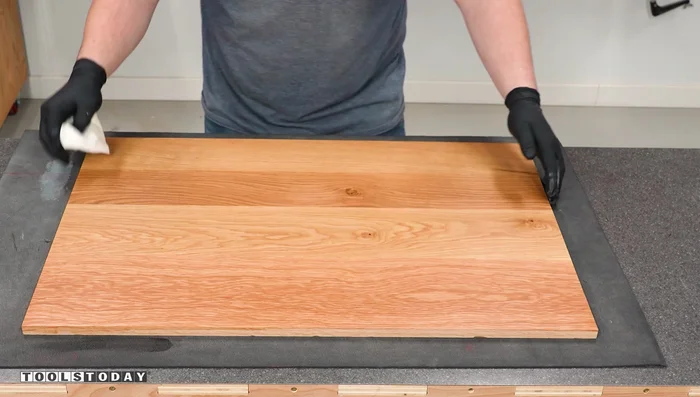 Touch up the edges of the backer board to prevent finish from entering the pockets.