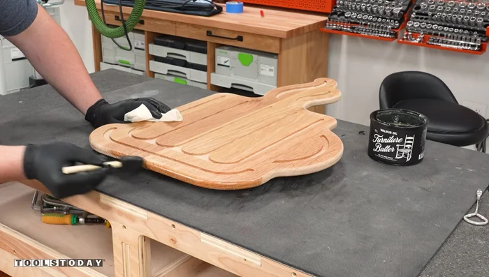 Touch up the edges of the backer board to prevent finish from entering the pockets.