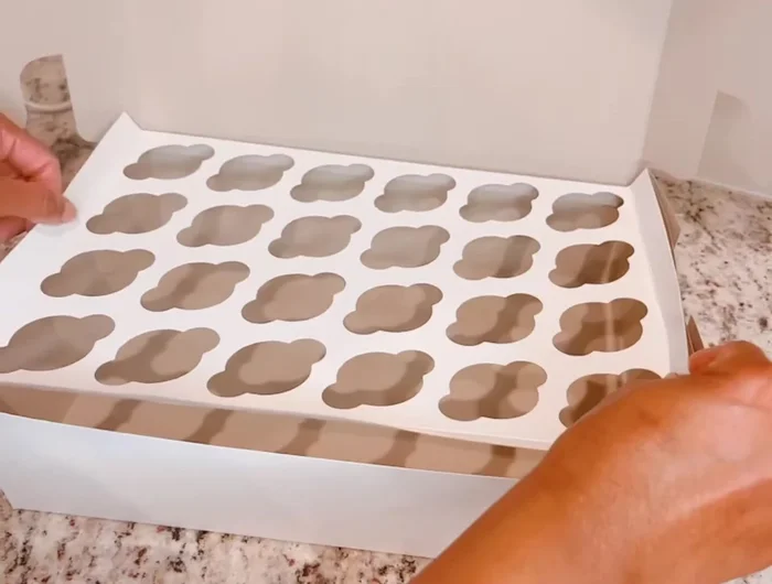 Secure the insert to the sides of the box using a staple gun. Staple on the left, then right, and finally the front of the box.