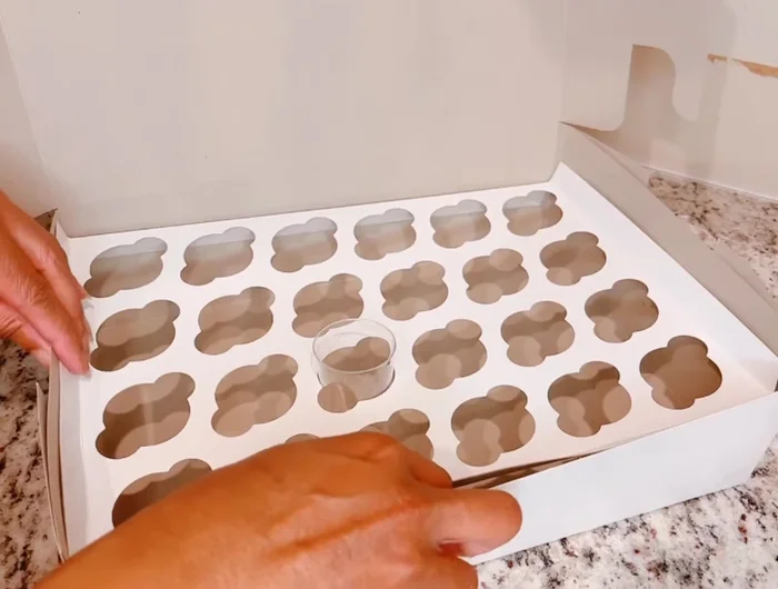 Secure the insert to the sides of the box using a staple gun. Staple on the left, then right, and finally the front of the box.