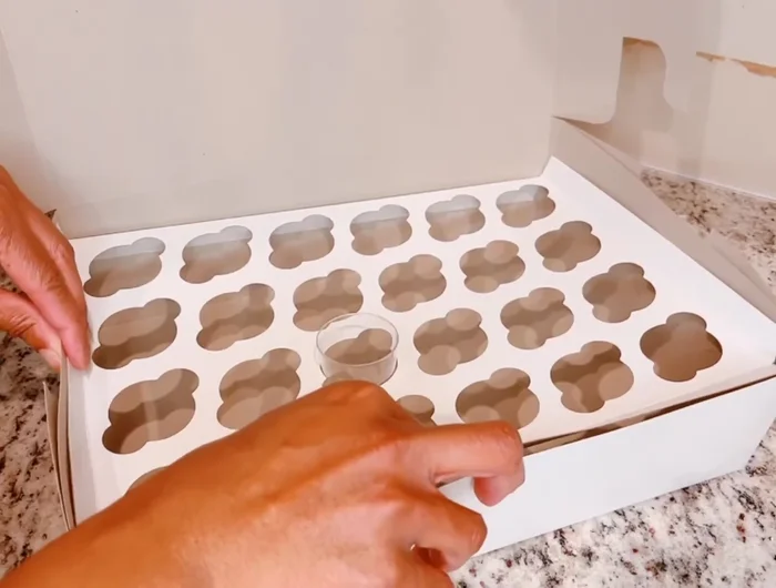 Test the stability of the box by shaking it gently to ensure the cups remain secure.