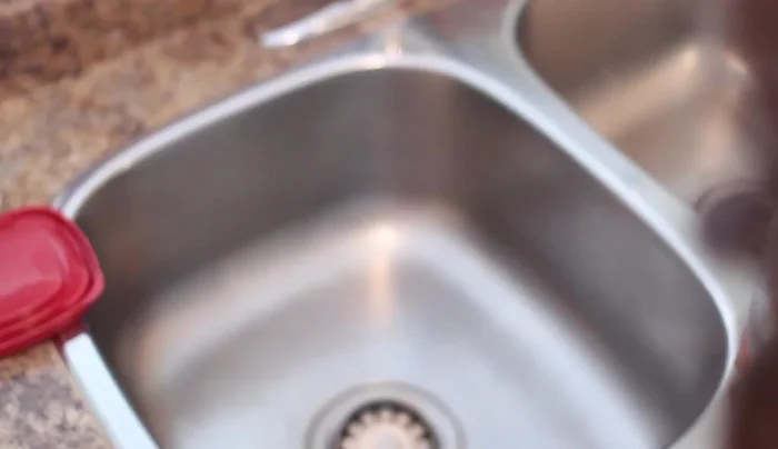 Empty the baking soda, rinse the container.