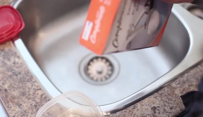 Empty the baking soda, rinse the container.