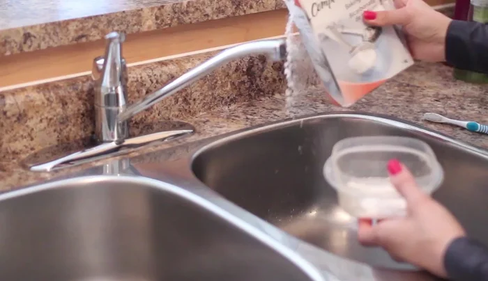 Scrub the containers with the paste using a cleaning toothbrush.