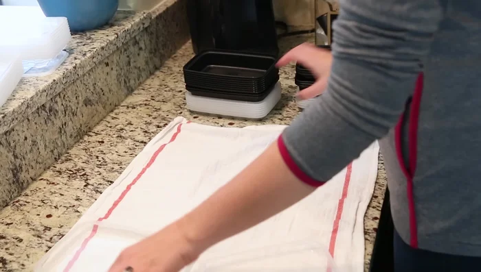 Stack containers for efficient and organized storage. Larger containers fit inside smaller ones.