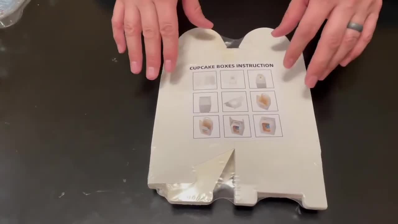 Unboxing the package of cupcake boxes
