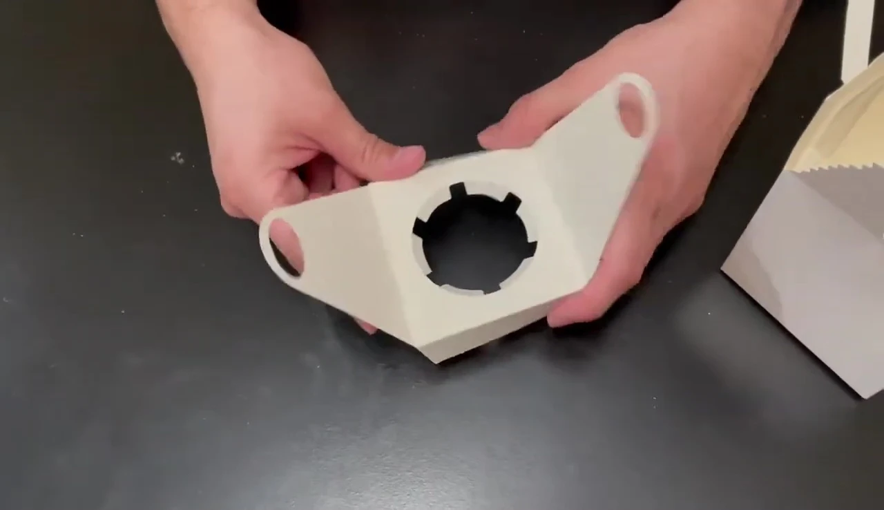 Inserting the cupcake into the box