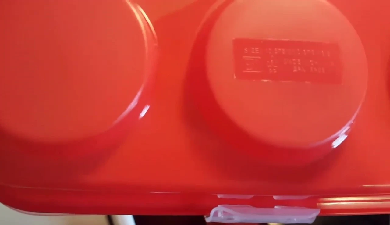 Recycling symbol and material information on the bottom of the carrier