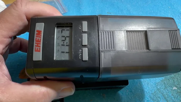 Identify the problem: The feeder gets stuck mid-cycle due to the weight of the food dispenser causing it to bend and jam.