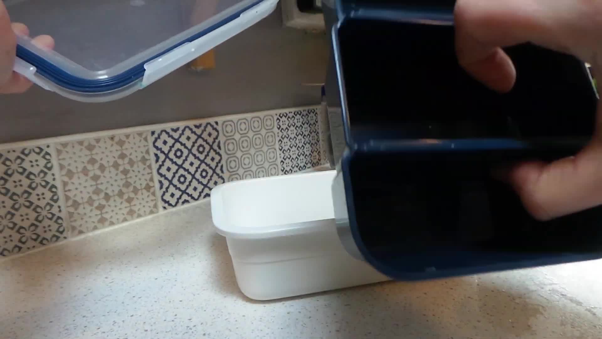 The lunchbox with its multiple compartments clearly visible.